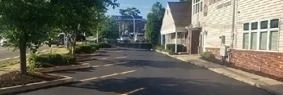 Family-owned paving crew resurfacing a driveway in Passaic County NJ