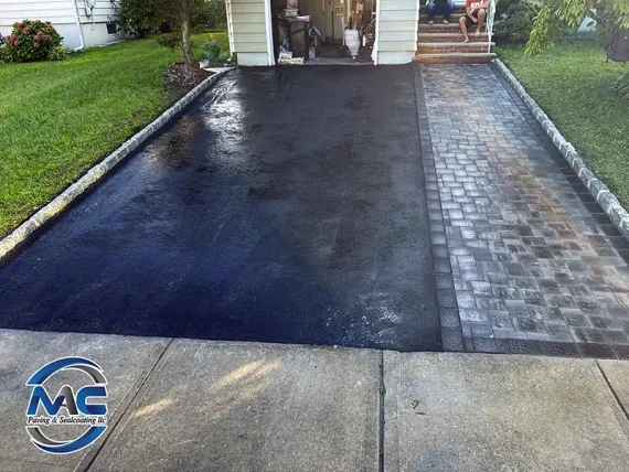 Custom asphalt apron with Belgium block border in Essex County NJ