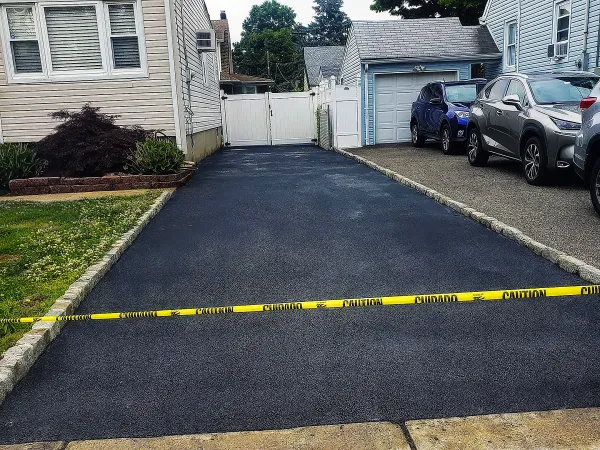 Driveway resurfacing crew improving asphalt in Passaic County NJ